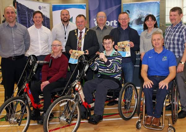 The Mayor Councillor Maoliosa McHugh,  launching  the District Council Disability Sports Hub project in the Foyle Arena, pictured with front (from left),  Mathew Mulheron and  Niall Callelly,  from the Evergreen Centre and Aubrey Bingham, Sport NI community sports manager.  Standing (from left), Barry OHagan, DCSDC Head of Leisure and Community Development, Ryan Porter, DCSDC, Michael Cooke, Sport NI,  Seamus McGilloway, chairman of DSCDC Sports Forum, and Council sports committee members Councillors Eric McGinley, Tina Gardiner and Derek Hussey.  The Hub project , funded by the Department of Communities through Sport NI, will see all eleven Council areas in Northern Ireland receiving disability sports equipment packs worth Â£50,000 each. The packs will include twelve sports wheelchairs, rugby wheelchair, three track chairs, five hand cycles, four tandem bikes, three trikes, three boccia sets and a sensory activity pack. 1017-0178MT..