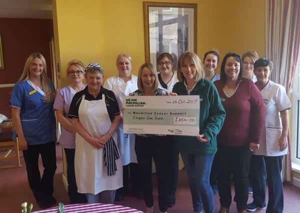 Home Manager, Maggie Jess and staff of Craigdun Care Home presented Pamela Palmer Volunteer with Macmillan Cancer Care with a cheque for Â£454 for the charity.