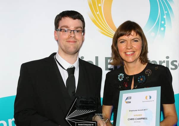 Chris Campbell receives his award from Rita Harkin, Support Officer (Northern Ireland) Architectural Heritage Fund.