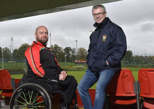 Former PSNI constable Peadar Heffron who lost his leg in a terrorist attack pictured with with former GAA player and radio presenter Joe Brolly at the Dub in Belfast. Photo: Presseye/Stephen Hamilton