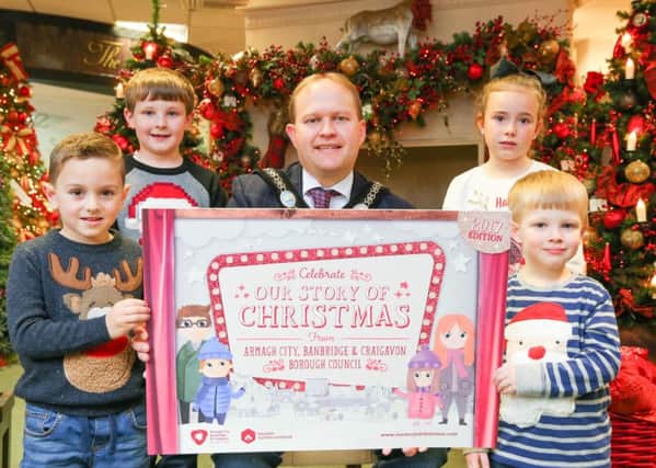 Lord Mayor Alderman Gareth Wilson is pictured at the launch of Our Story of Christmas campaign with his band of little helpers which include his two sons. From left are Jake Garvey, Lewis Wilson, Tara Brennan and Micah Wilson.