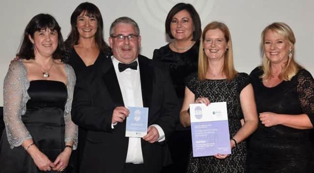 Northern Trust Biomedical Scientist Dissectors, Yvonne Cole from Ballymena, Ian Clarke, Valerie Hinch and Elaine Donald-Magill receive their Advancing Healthcare Award from Jo Scott, BBC News presenter and Charlotte McArdle, Chief Nursing Officer, Department of Health.