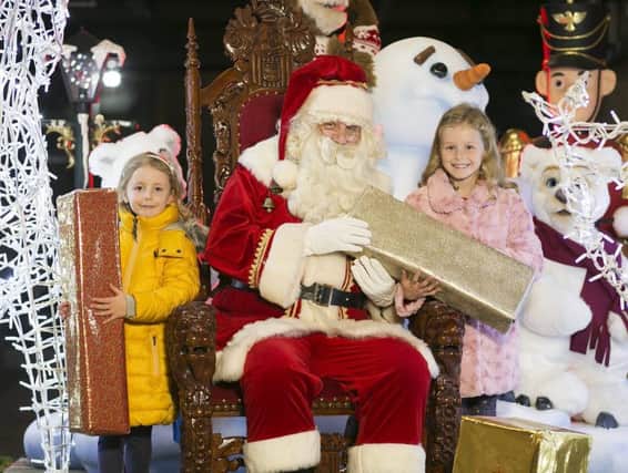 The magic of Christmas comes to Craigavon this month with the arrival of Santa Claus and the big lights switch-on at Rushmere Shopping Centre on Thursday, 9th November. Santa will arrive at 6:00pm to the sound of music and make his way past the family of snowmen, toy soldiers and dancing bears with free festive chocolate lollies for young and old alike until he reaches the giant Christmas tree to hit the big red button and illuminate the festive decorations which will shine brightly until January. He can then be visited in his Snow House until Christmas Eve and children are invited to post their letters in the big red post box. Anna (6) and Ella (8) McMullan joined Santa to help wrap some gifts for Christmas. For more information on SantaÃ¢Â¬"s arrival at Rushmere please visit www.rushmereshopping.com.