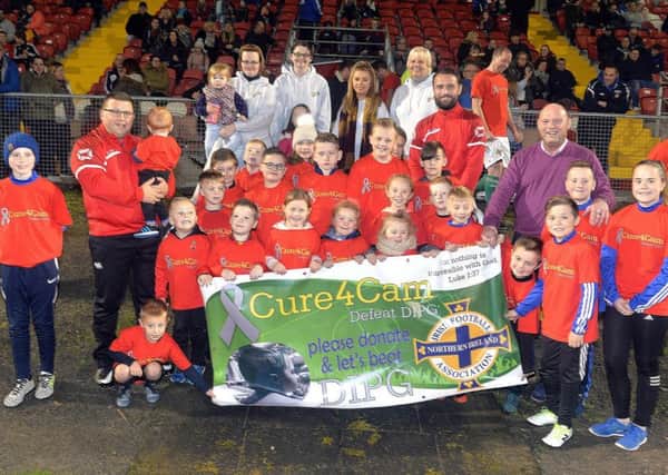 Mascots, ball boys and family members pictured wit the Irish League Legends manager, David Jeffrey at the Cure 4 Cam fundraising football match at Shamrock park on Friday night. INPT44-201.