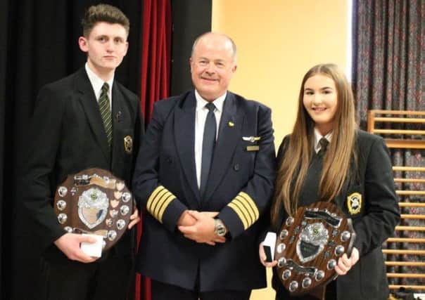 St Patrick's Prize Day guest Captain Con Law with Head Boy Padraig O'Neill and Head Girl Edele McKay.