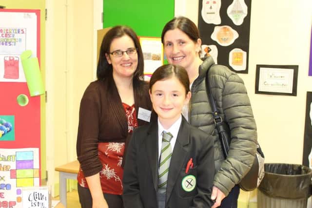 Ceira Kerr with mum Donna and form tutor Mrs Nolan  at the St Patrick's Academy coffee morning and book fair