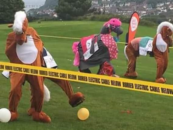 The pantomime horse race at Whitehead Golf Club.
