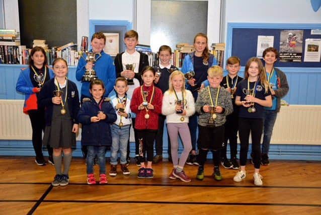 Young swimmers celebrating success at Whitehead Swiming Club prize giving.