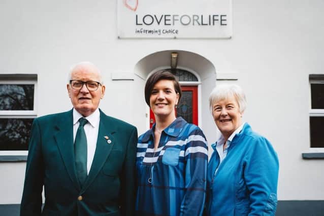 Volunteer Ted Harrison; Chief Executive, Judith Cairns and Chair Mrs Helen Clarke prepare for the grand opening of the new offices in Waringstown.