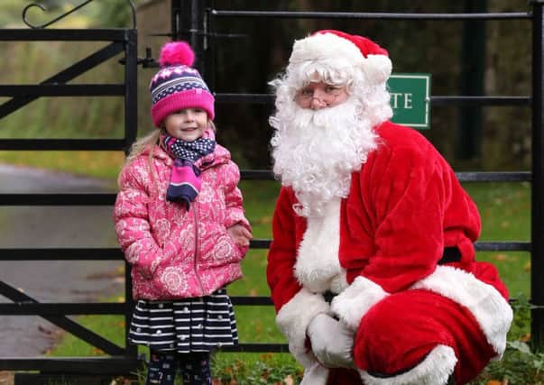 Evie Morrison (5) with Santa.