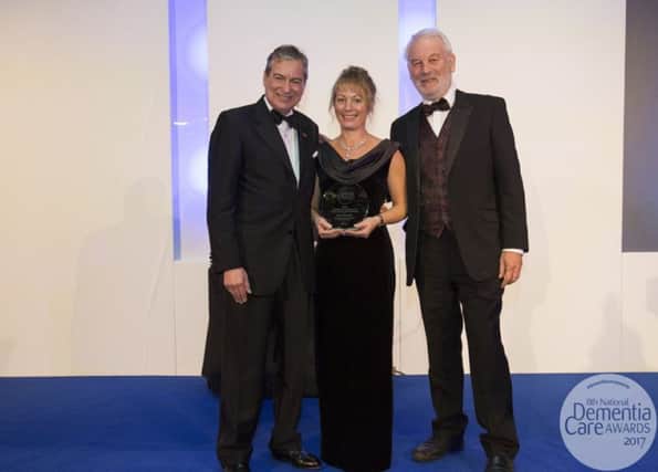 Emerald Weir, recieves her award from John Middleton (actor) on the left and Chris Harding (Founder of the Daily Sparkle) on the right.
