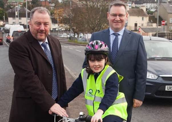 P7 pupil Megan McKeown helps launch the NI Primary School Road Safety quiz along with Davy Jackson, from event organisers, Road Safe NI, and Jonathan McKeown of event sponsors, CRASH Services