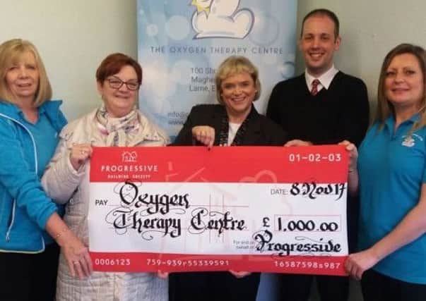 Manager Elaine Molyneaux and Andrew Hibbert from the Progressive Building Society are pictured presenting a cheque for Â£1000 to The Oxygen Therapy Centre Chairperson Norma Shannon, Centre Manager Vickie Shaw and Linda Boyd