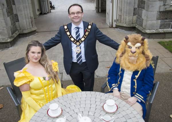Mayor of Antrim and Newtownabbey Borough Council, Cllr Paul Hamill pictured with Beauty and The Beast.