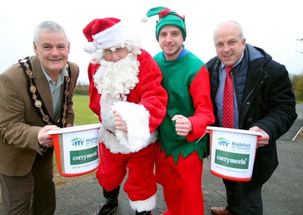 The Mayor of Lisburn & Castlereagh City Council, Councillor Tim Morrow and Alderman, James Tinsley Chairman of the Councils Leisure & Community Development Committee are joined by Santa Claus and Buddy the Elf to launch the 2017 Santa Dash at Lough Moss Leisure Centre, Carryduff