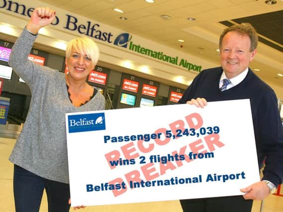 Passenger 5,243,039 Glenda Garrett from Larne wins Tickets to Fly to mark Belfast International Airport record.